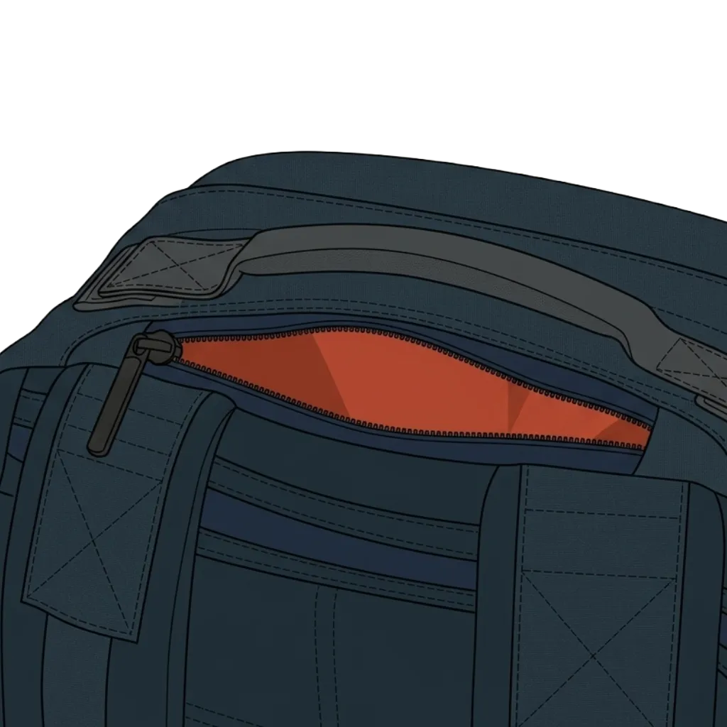Top of a backpack with the quick-access pocket unzipped — a horizontal pocket along the upper edge, lined in terracotta and isolated from the main compartment, holding the small items you reach for in transit without unpacking.